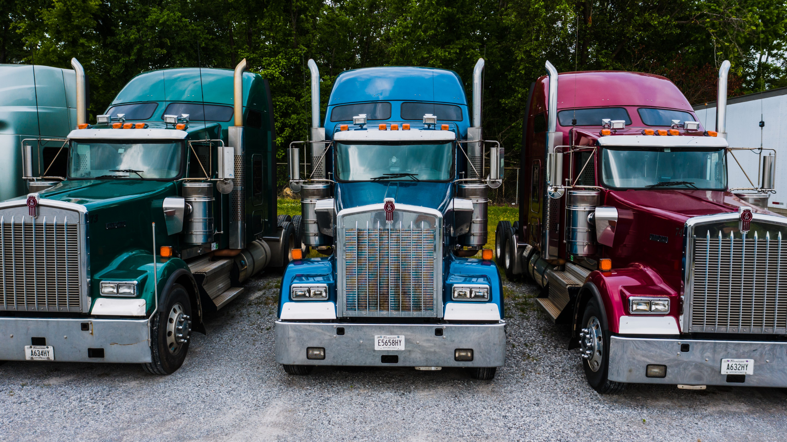 Several semi trucks parked together